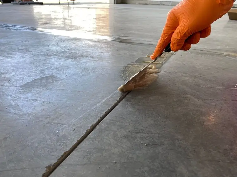 Concrete joint repair before floor coating