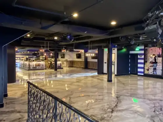 Commercial metallic floor with railing by Epoxy Pros
