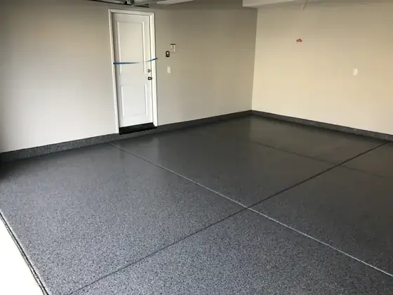 Dark flake garage floor with clean control joints by Epoxy Pros