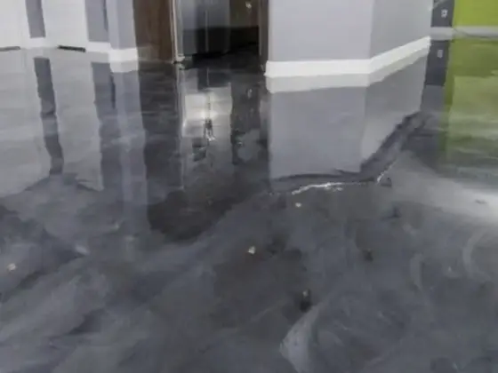 Gray metallic kitchen floor by Epoxy Pros