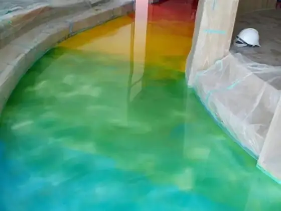 Custom green metallic epoxy floor by Epoxy Pros