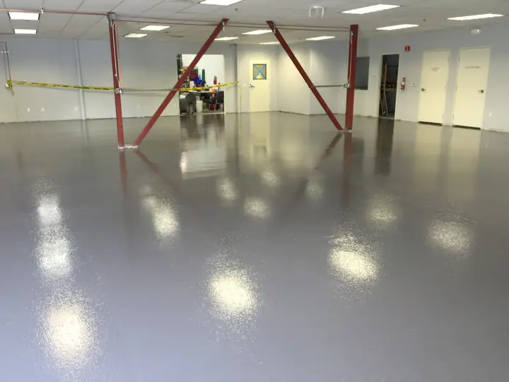 Large commercial shop floor with a glossy epoxy coating