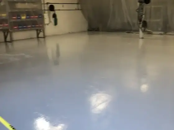 Light gray commercial epoxy floor by Epoxy Pros
