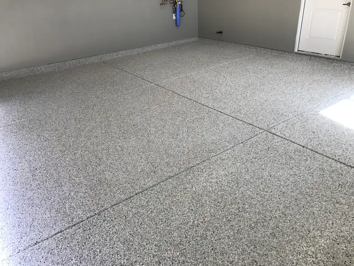 Residential garage with a new decorative flake epoxy floor