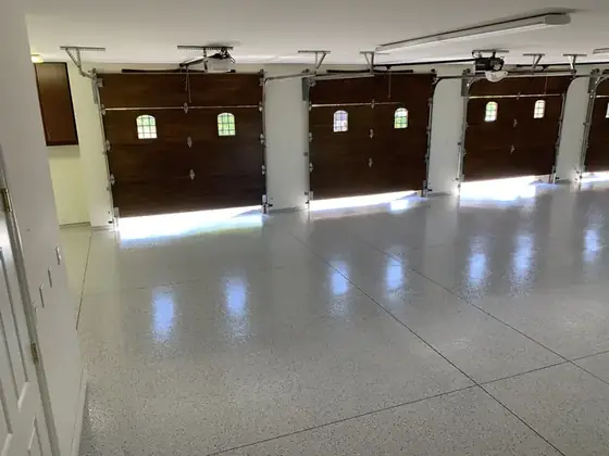 Three-bay residential garage floor coating by Epoxy Pros