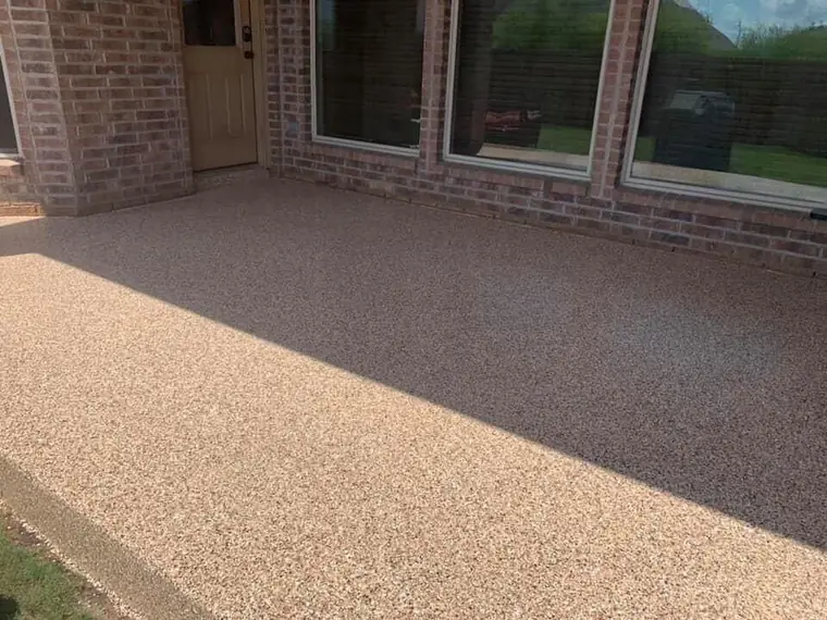Tan flake patio concrete coating in Kuna style